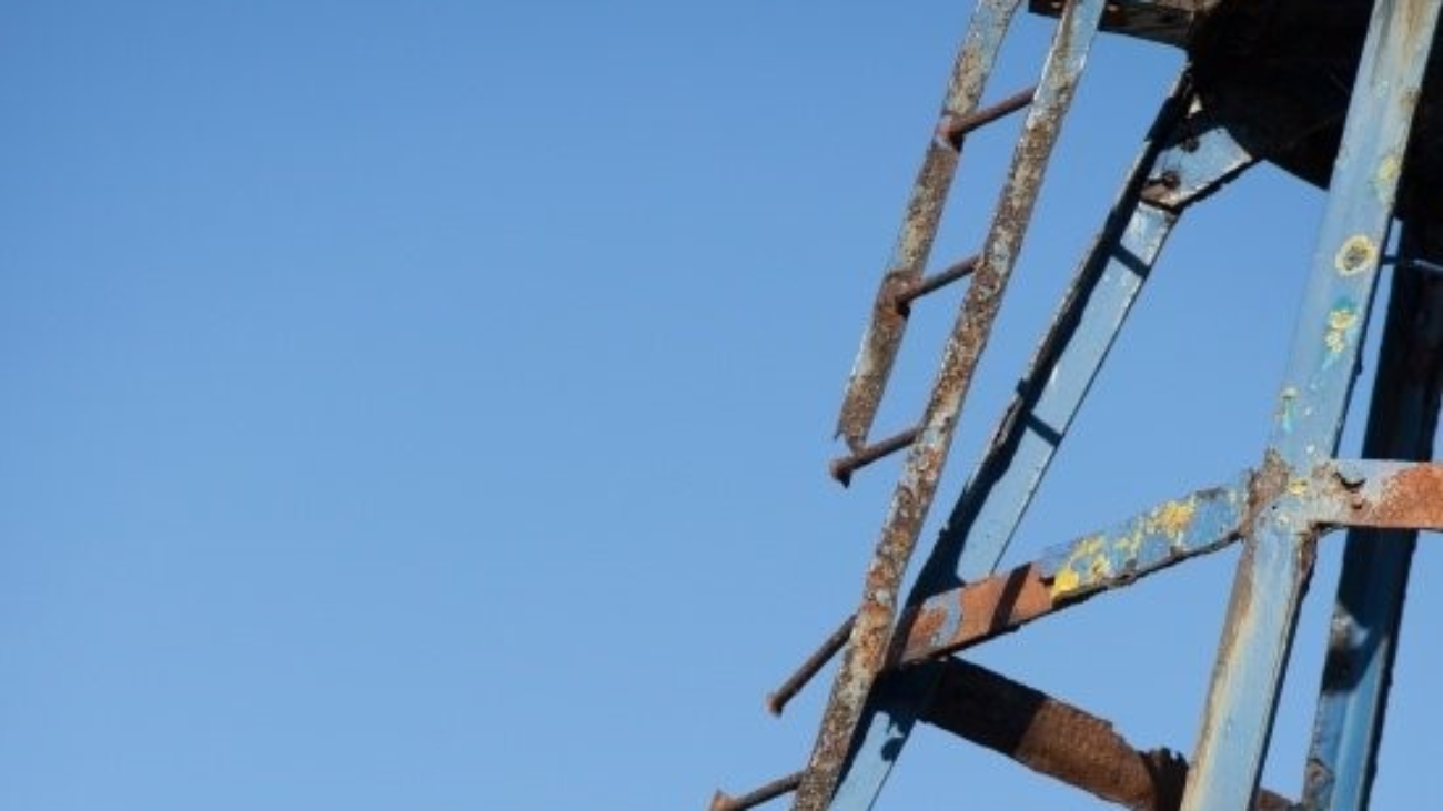 a broken ladder on industrial equipment