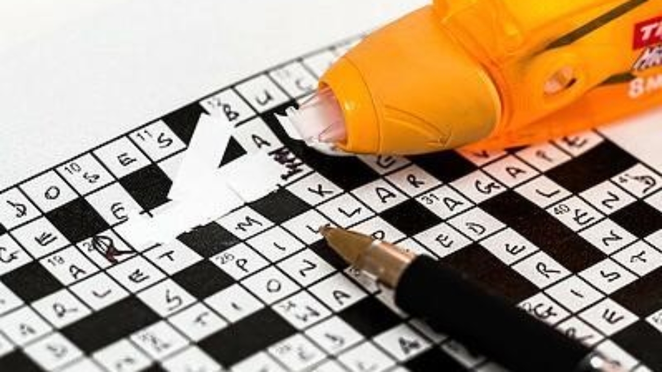 a crossword puzzle being tipex'd out